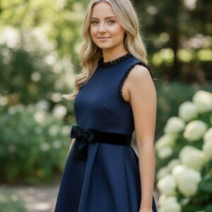 Kate Spade Velvet Bow Fit and Flare with ruffle edges.